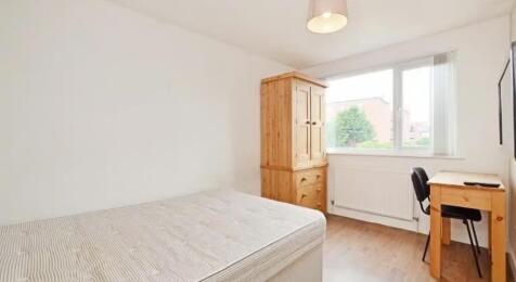 Bright and inviting double bedroom featuring a ...