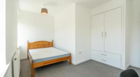 Bright and inviting double bedroom featuring am...