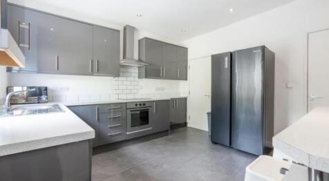 Discover this modern kitchen featuring sleek ca...