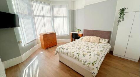 Bright and inviting double bedroom featuring am...
