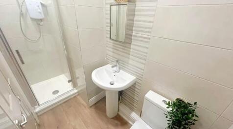This modern bathroom features a sleek design wi...
