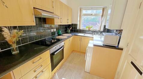 This well-appointed kitchen features modern cab...