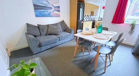 A cozy and inviting living room featuring a com...