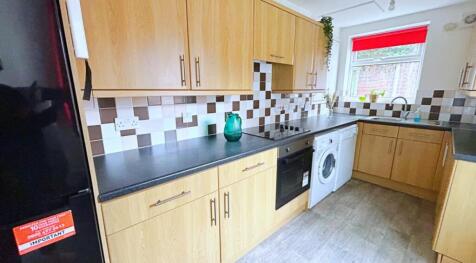 This modern kitchen features ample storage with...