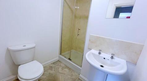 This modern bathroom features a sleek shower, c...