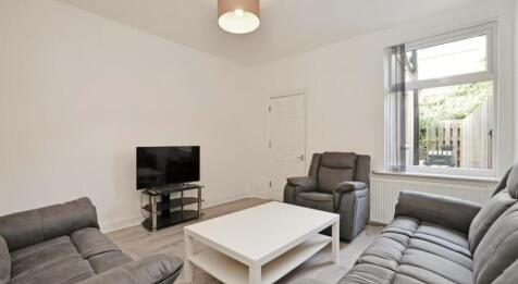 Bright and inviting living room featuring comfo...