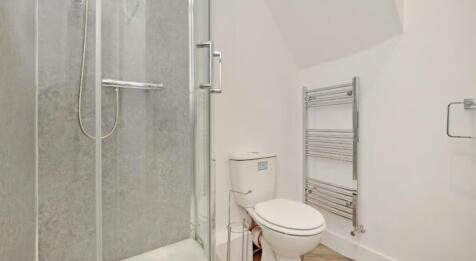 This well-appointed bathroom features a sleek s...