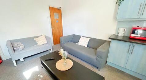 A cozy and inviting living room featuring comfo...