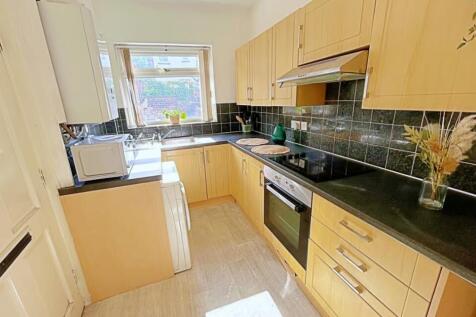 This well-appointed kitchen features modern cab...
