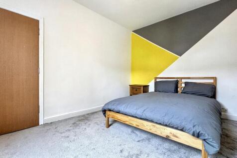 Bright and inviting double bedroom featuring mo...