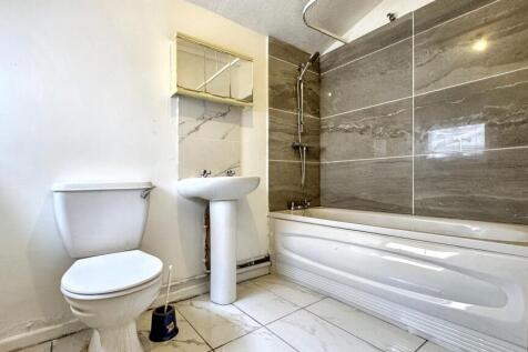 Bright and modern bathroom featuring a sleek ba...