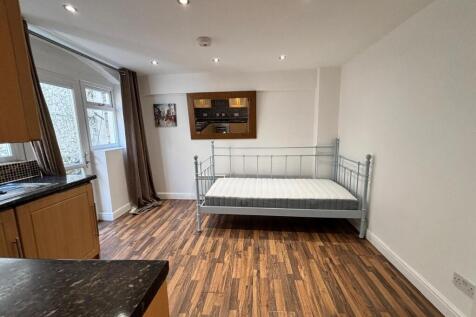 This charming double bedroom features a cozy la...