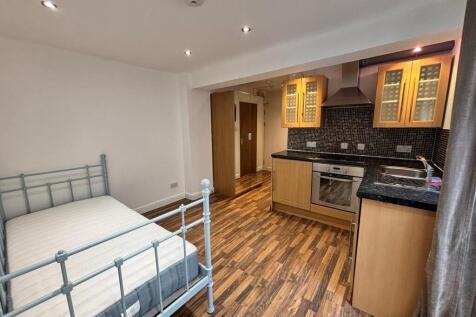 This inviting double bedroom features modern fu...