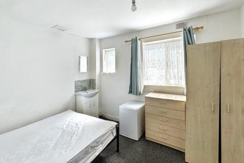Charming double bedroom featuring ample storage...