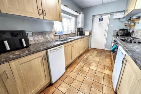 A well-maintained kitchen featuring ample count...