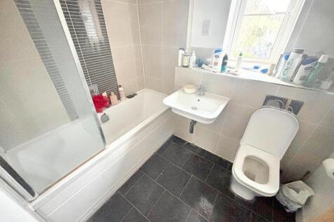A well-equipped bathroom featuring a spacious b...