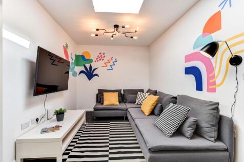 This vibrant communal lounge boasts modern deco...