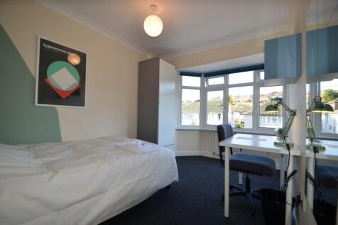 A bright and inviting double bedroom featuring ...