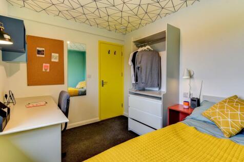A cozy and modern double bedroom featuring a vi...