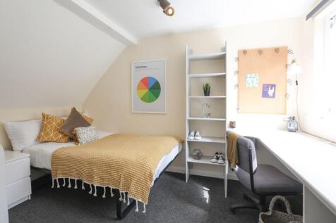 This charming double bedroom features a cozy la...