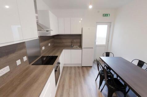 Modern kitchen featuring sleek cabinetry and am...
