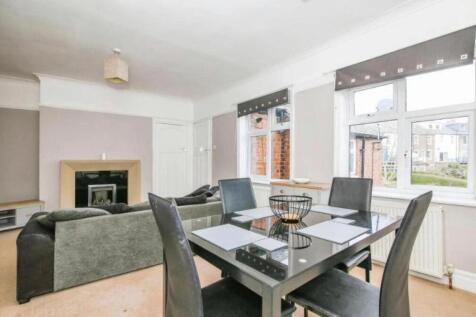A spacious and inviting living room featuring l...