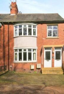 Charming front view of a cozy brick property wi...