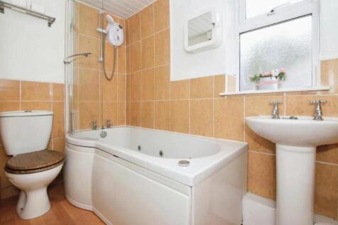 This charming bathroom features a sleek design ...