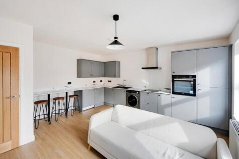 A modern kitchen with a clean design, featuring...