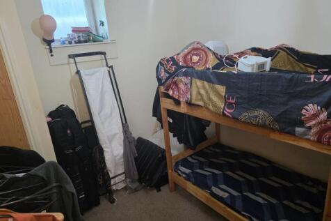 Cozy double bedroom featuring a bunk bed and am...