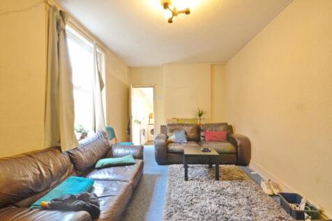 Spacious and inviting living room featuring a c...