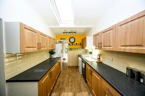 A bright and spacious kitchen featuring modern ...
