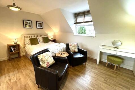 A spacious and inviting large double bedroom, p...