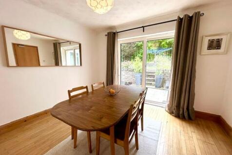 A bright and inviting living room with ample sp...