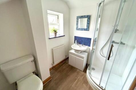 A bright and modern bathroom featuring a stylis...