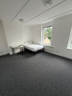 Bright and spacious double bedroom featuring a ...