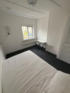 A bright and cozy double bedroom featuring a sp...