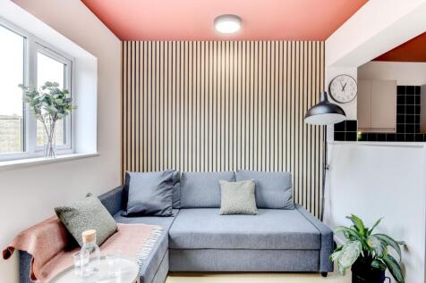 This stylish living room features contemporary ...