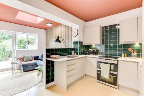 This modern kitchen features a stylish design w...