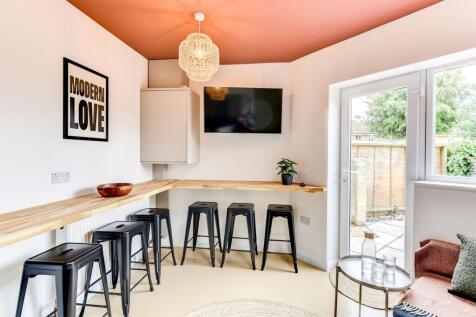 A vibrant communal workspace featuring stylish ...