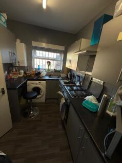 This cozy kitchen features modern appliances an...
