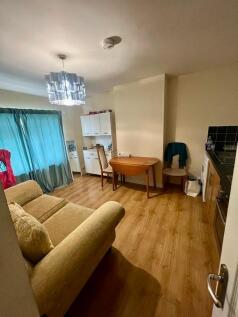 Bright and inviting living room featuring a coz...