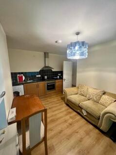 This inviting kitchen features modern appliance...