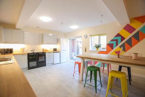 This vibrant kitchen features a spacious layout...