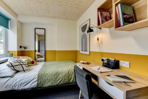 Stylishly designed double bedroom featuring a c...