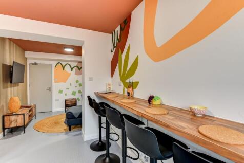 A vibrant communal workspace featuring a stylis...