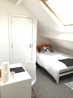 This charming double bedroom features ample nat...