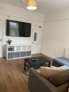 Spacious living room featuring modern furnishin...