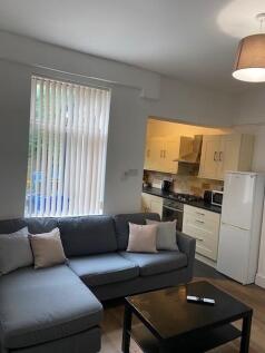 This inviting living room features a spacious l...