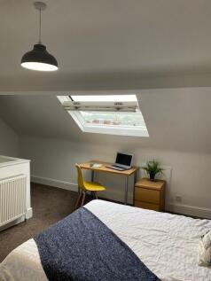 A beautifully designed double bedroom featuring...